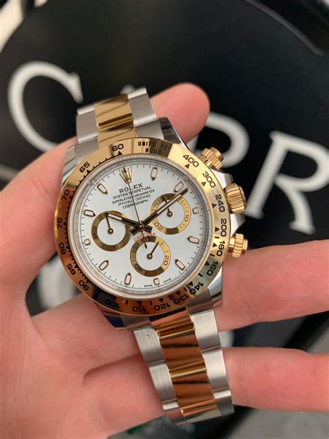 rolex cosmograph daytona steel and yellow gold price|rolex panda daytona white gold.